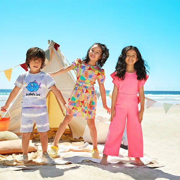 Three Kids at the Beach Wearing Rb Clothing for Kids