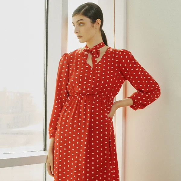 a Woman Wearing a Red Polka Dot Dress from His Hers